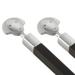 Conjunto de dos palillos de ébano con soporte de inox Alessandro Mendini Alessi