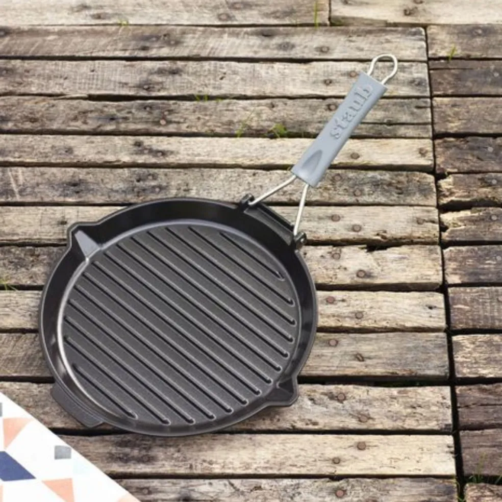 Parrilla redonda de hierro fundido con mango plegable Staub