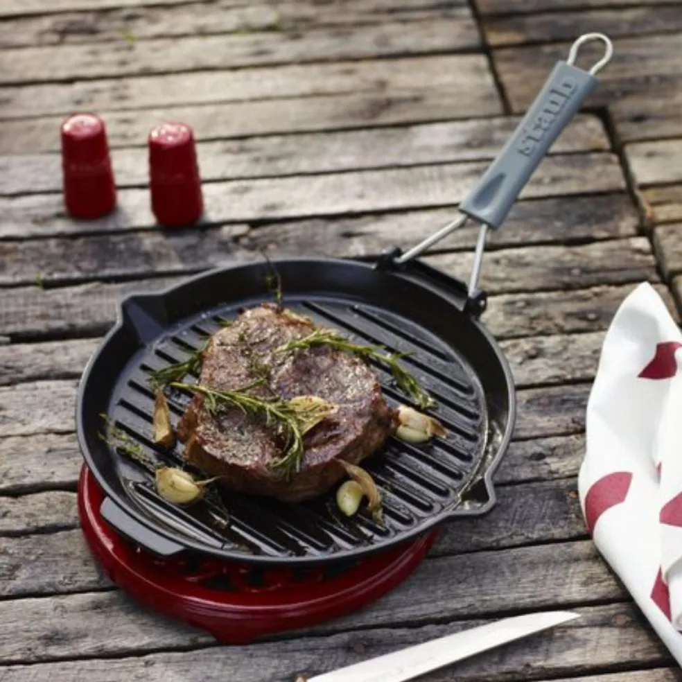 Parrilla redonda de hierro fundido con mango plegable Staub